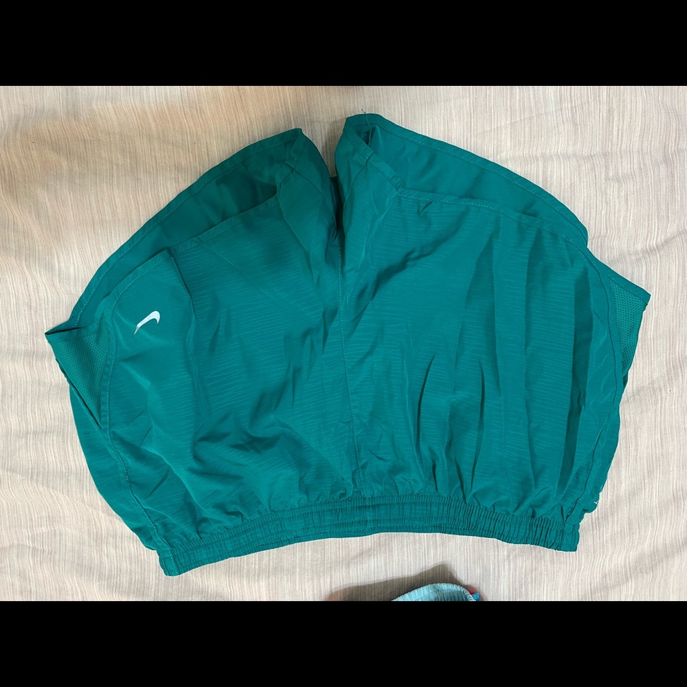 Teal Nike running shorts